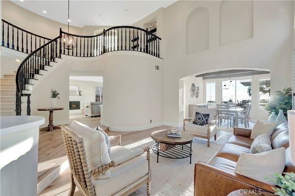 Chandelier, Dining room, Fireplace, Interior, Living room, Pendant Lights, Recessed Lighting, Wood Texture Flooring