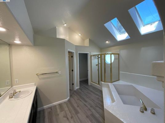 Bathroom, Dual Sink Vanities, Interior, Recessed Lighting, Wood Texture Flooring
