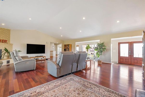 Fireplace, Interior, Living room, Recessed Lighting, Stone Walls, Wood Texture Flooring