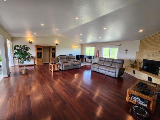 Fireplace, Interior, Living room, Recessed Lighting, Stone Walls, Wood Texture Flooring