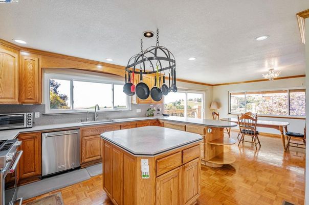 Dining room, Interior, Kitchen, Recessed Lighting, Stainless Steel Appliances, Wood Texture Flooring