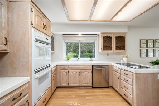 Interior, Kitchen, Stainless Steel Appliances, Tile Countertops, Wood Texture Flooring