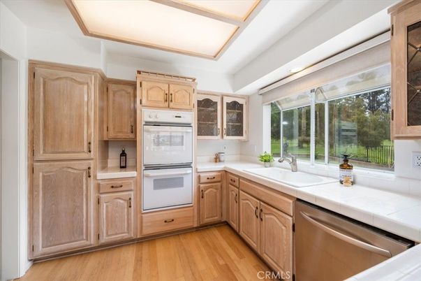 Interior, Kitchen, Recessed Lighting, Tile Countertops, Wood Texture Flooring