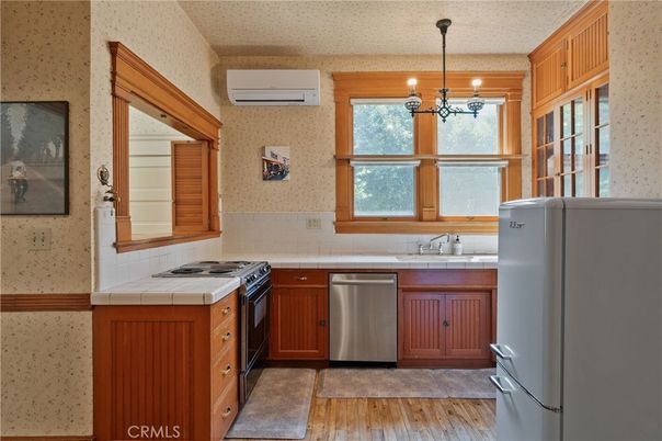Interior, Kitchen, Pendant Lights, Stainless Steel Appliances, Tile Countertops, Wood Texture Flooring