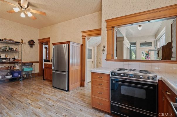 Interior, Kitchen, Stainless Steel Appliances, Tile Countertops, Wood Texture Flooring