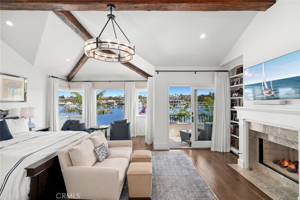Bedroom, Fireplace, Interior, Living room, Pendant Lights, Recessed Lighting, Water, Wooden Beams, Wood Texture Flooring