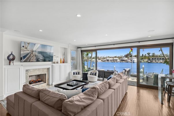 Fireplace, Interior, Living room, Recessed Lighting, Water, Wood Texture Flooring