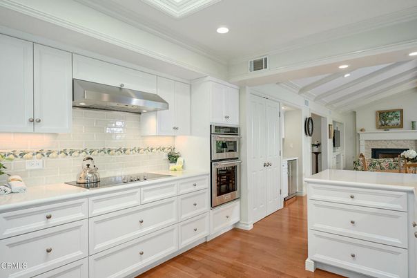 Fireplace, Interior, Kitchen, Recessed Lighting, Stainless Steel Appliances, Wood Texture Flooring
