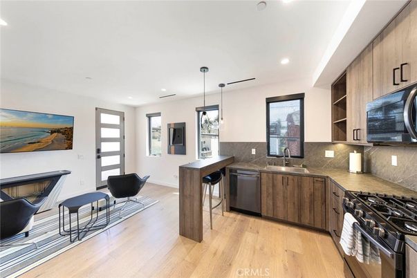 Interior, Kitchen, Pendant Lights, Recessed Lighting, Stainless Steel Appliances, Wood Texture Flooring