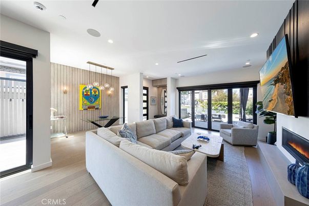 Dining room, Fireplace, Interior, Living room, Pendant Lights, Recessed Lighting, Wood Texture Flooring