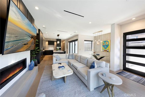 Dining room, Fireplace, Interior, Living room, Pendant Lights, Recessed Lighting, Wood Texture Flooring