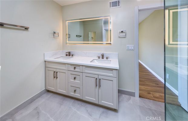 Bathroom, Dual Sink Vanities, Glass Shower, Interior, Wood Texture Flooring