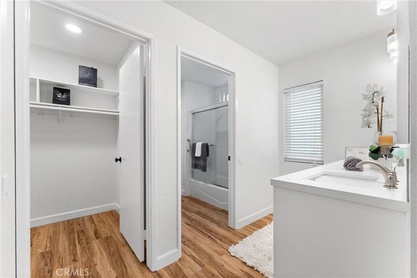 Bathroom, Glass Shower, Interior, Recessed Lighting, Walk-in Closets, Wood Texture Flooring