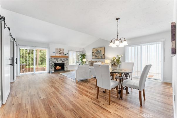 Chandelier, Dining room, Fireplace, Interior, Living room, Pendant Lights, Wood Texture Flooring