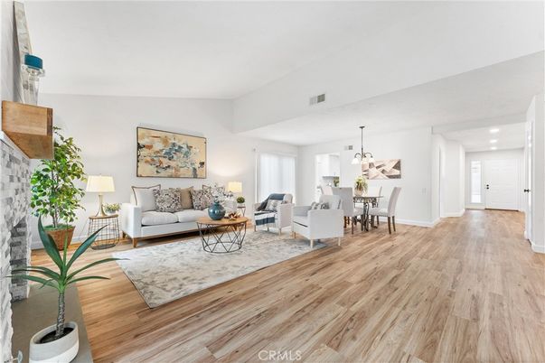 Dining room, Fireplace, Interior, Living room, Pendant Lights, Recessed Lighting, Wood Texture Flooring