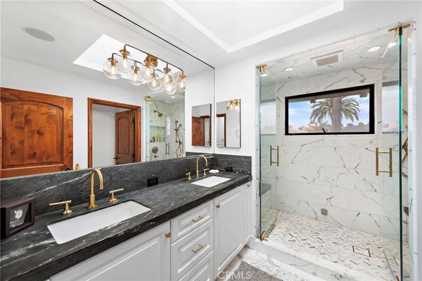 Bathroom, Dual Sink Vanities, Glass Shower, Interior, Marble, Marble Walls, Recessed Lighting