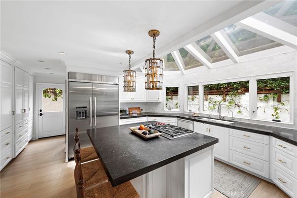 Chandelier, Interior, Kitchen, Pendant Lights, Recessed Lighting, Stainless Steel Appliances, Wood Texture Flooring