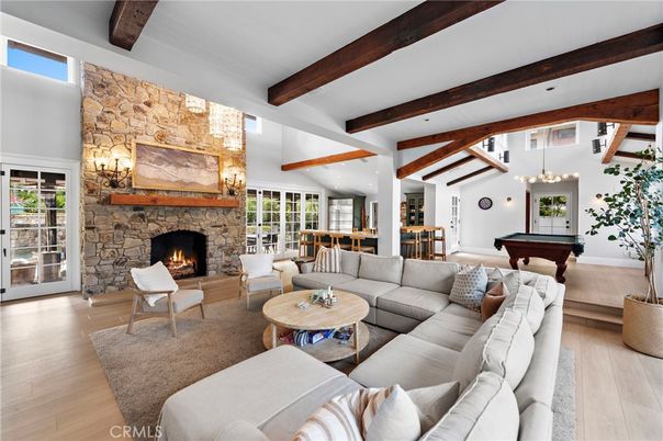 Billiard Table, Fireplace, Game Room, Interior, Living room, Pendant Lights, Recessed Lighting, Stone Walls, Wooden Beams, Wood Texture Flooring
