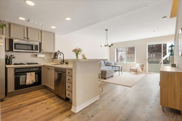 Dining room, Interior, Kitchen, Living room, Pendant Lights, Recessed Lighting, Stainless Steel Appliances, Wood Texture Flooring