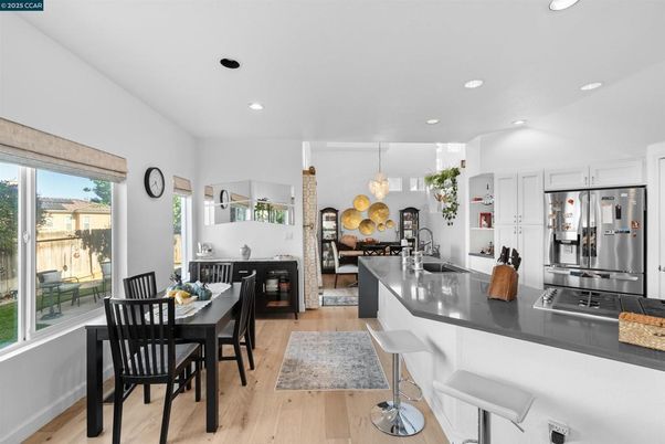 Dining room, Interior, Kitchen, Pendant Lights, Recessed Lighting, Stainless Steel Appliances, Wood Texture Flooring