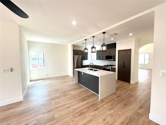 Interior, Kitchen, Pendant Lights, Recessed Lighting, Stainless Steel Appliances, Wood Texture Flooring