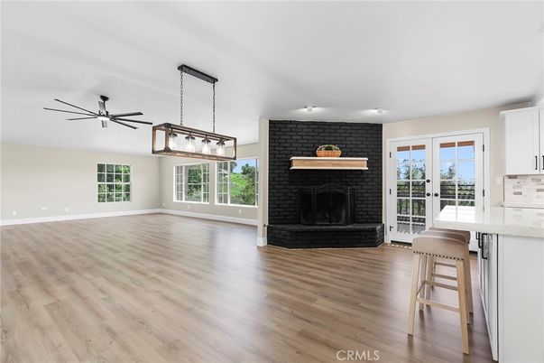Empty room, Fireplace, Interior, Kitchen, Pendant Lights, Stone Walls, Wood Texture Flooring