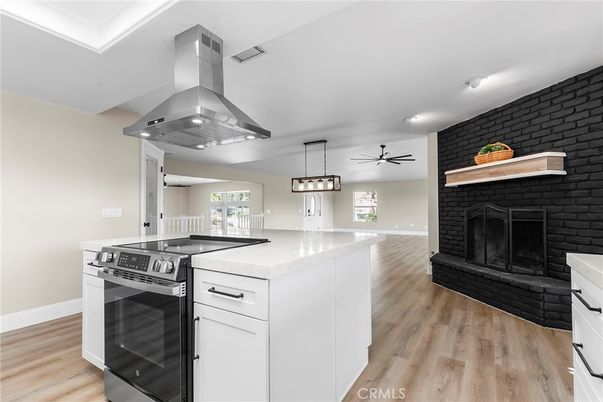 Fireplace, Interior, Kitchen, Pendant Lights, Recessed Lighting, Stainless Steel Appliances, Wood Texture Flooring