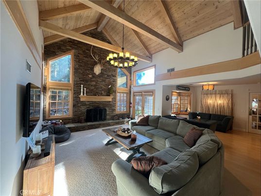 Chandelier, Fireplace, Interior, Living room, Stone Walls, Wooden Beams, Wooden Ceilings, Wood Texture Flooring