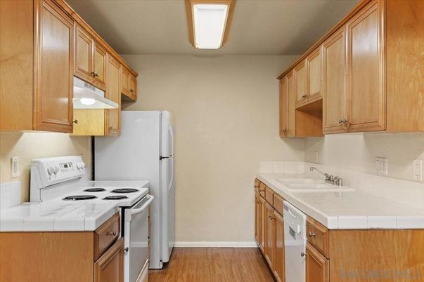 Interior, Kitchen, Tile Countertops, Wood Texture Flooring