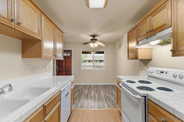 Interior, Kitchen, Tile Countertops, Wood Texture Flooring