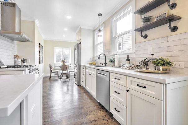 Dining room, Interior, Kitchen, Pendant Lights, Recessed Lighting, Stainless Steel Appliances, Wood Texture Flooring