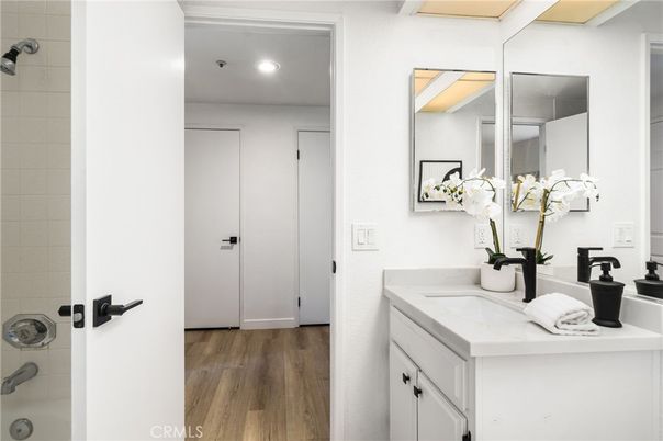 Bathroom, Dual Sink Vanities, Interior, Recessed Lighting, Wood Texture Flooring