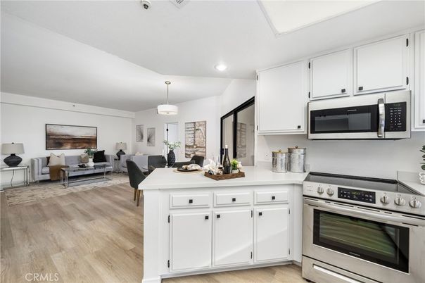 Dining room, Interior, Kitchen, Living room, Pendant Lights, Recessed Lighting, Stainless Steel Appliances, Wood Texture Flooring