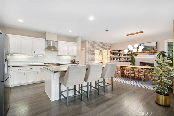 Dining room, Fireplace, Interior, Kitchen, Pendant Lights, Recessed Lighting, Stainless Steel Appliances, Wood Texture Flooring