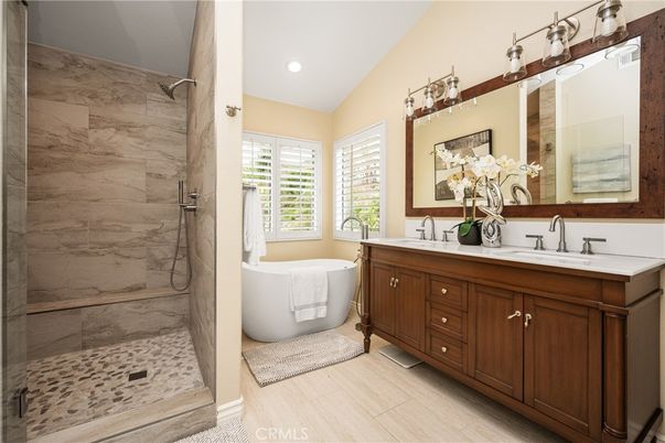 Bathroom, Dual Sink Vanities, Free Standing Baths, Interior, Marble Walls, Recessed Lighting, Wood Texture Flooring