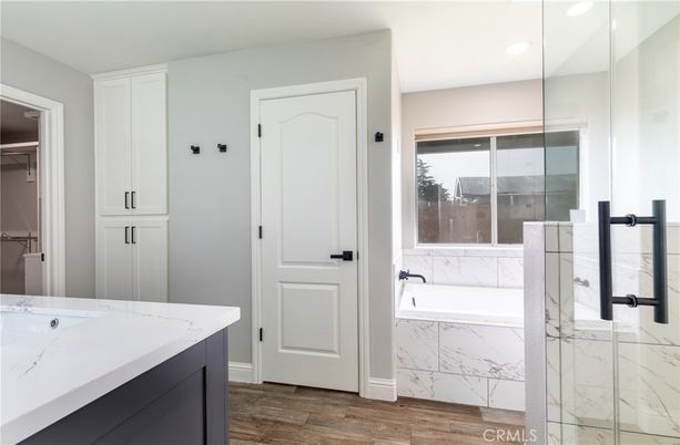 Bathroom, Glass Shower, Interior, Marble Walls, Recessed Lighting, Wood Texture Flooring