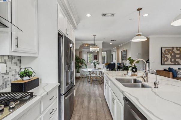 Chandelier, Dining room, Interior, Kitchen, Pendant Lights, Recessed Lighting, Stainless Steel Appliances, Wood Texture Flooring