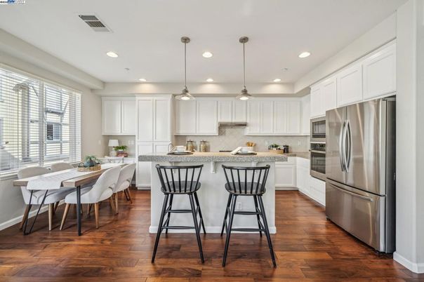 Dining room, Interior, Kitchen, Pendant Lights, Recessed Lighting, Stainless Steel Appliances, Wood Texture Flooring