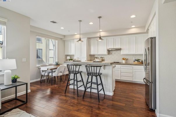 Dining room, Interior, Kitchen, Pendant Lights, Recessed Lighting, Stainless Steel Appliances, Wood Texture Flooring