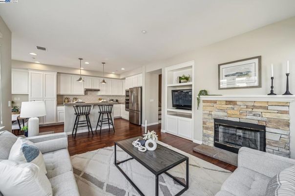 Fireplace, Interior, Kitchen, Living room, Pendant Lights, Recessed Lighting, Stainless Steel Appliances, Wood Texture Flooring