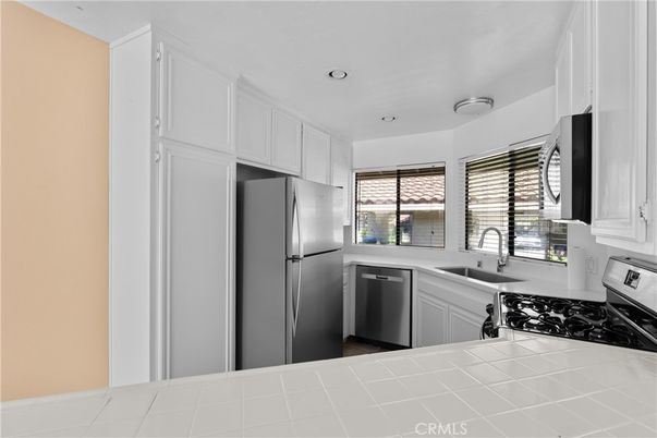 Interior, Kitchen, Recessed Lighting, Stainless Steel Appliances, Tile Countertops