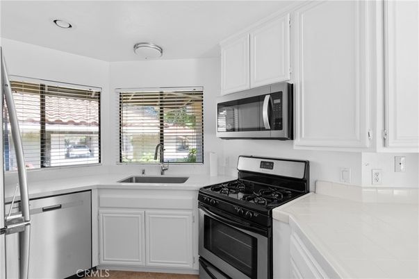 Interior, Kitchen, Recessed Lighting, Stainless Steel Appliances, Tile Countertops