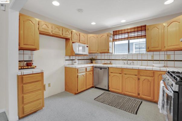 Interior, Kitchen, Recessed Lighting, Stainless Steel Appliances, Tile Countertops