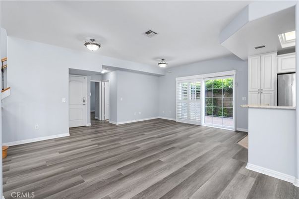 Empty room, Interior, Kitchen, Stainless Steel Appliances, Wood Texture Flooring
