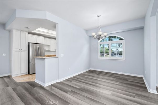 Chandelier, Empty room, Interior, Kitchen, Stainless Steel Appliances, Wood Texture Flooring