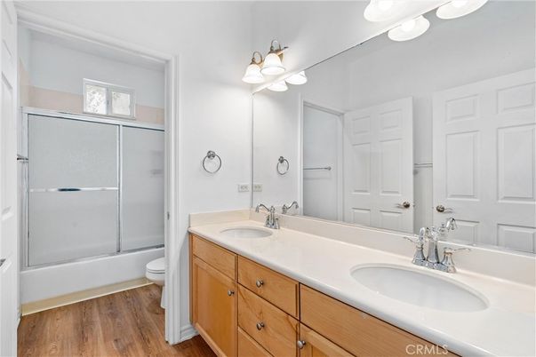 Bathroom, Dual Sink Vanities, Glass Shower, Interior, Wood Texture Flooring