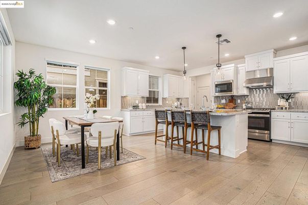 Dining room, Interior, Kitchen, Pendant Lights, Recessed Lighting, Stainless Steel Appliances, Wood Texture Flooring