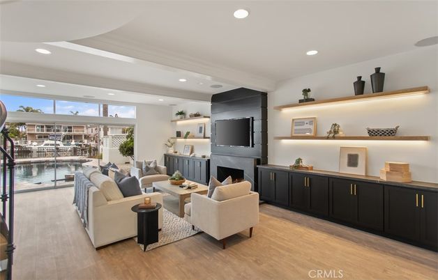 Fireplace, Interior, Living room, Recessed Lighting, Water, Wood Texture Flooring