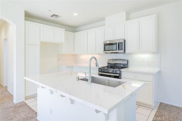 Interior, Kitchen, Marble Walls, Recessed Lighting, Stainless Steel Appliances