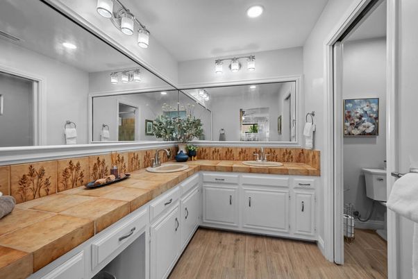 Bathroom, Dual Sink Vanities, Interior, Recessed Lighting, Tile Countertops, Wood Texture Flooring